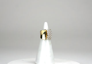 This elegant but understated ring features a square pavé of 23 round brilliant cut diamonds that sits like a buckle atop an 18K gold band. The band is countoured and narrows at the bottom. Approximately 0.65 carats total. 7.40 dwts. Available at fonfrege.com