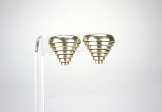 Designer: unknown Period: 1980 Dimensions: 1”x1” Material: sterling 925 Condition: Very good  We call these “Tiernado” because they are like a modernist vision of a tornado, brilliantly architectural, with great chunky heft that makes them instantly a statement. Clip on earrings. Available at Fonfrege.com