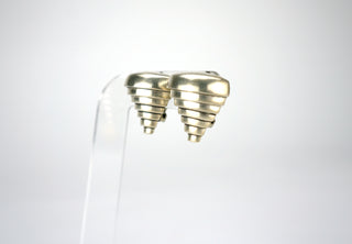 Designer: unknown Period: 1980 Dimensions: 1”x1” Material: sterling 925 Condition: Very good  We call these “Tiernado” because they are like a modernist vision of a tornado, brilliantly architectural, with great chunky heft that makes them instantly a statement. Clip on earrings. Available at Fonfrege.com