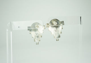 Murray Jackson is an artisan within the Arizona Hualapai reservation. These bold shields have the geometric symmetry which Zuni design is famous for. The cabochons are finely detailed and individually framed in silver. Exceptionally fine workmanship. Please note these are stud earrings, not clips. Available at Fonfrege.com