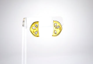 A vintage pair of Givenchy “lemon slice” earrings each featuring three rhinestone seeds. Givenchy made many fruity-themed earrings, necklaces, and brooches over the years, but these are remarkable in their subtly and simplicity. Pucker up and clip on. Available at Fonfrege.com