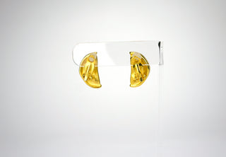 A vintage pair of Givenchy “lemon slice” earrings each featuring three rhinestone seeds. Givenchy made many fruity-themed earrings, necklaces, and brooches over the years, but these are remarkable in their subtly and simplicity. Pucker up and clip on. Available at Fonfrege.com