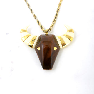 “Taurus” Bull Pendant  Designer: Givenchy  Material: gold plated metal, resin  Period: 1960s Available at Fonfrege.com