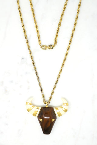 “Taurus” Bull Pendant Designer: Givenchy Material: gold plated metal, resin Period: 1960s Available at Fonfrege.com