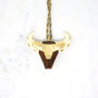 “Taurus” Bull Pendant Designer: Givenchy Material: gold plated metal, resin Period: 1960s Available at Fonfrege.com