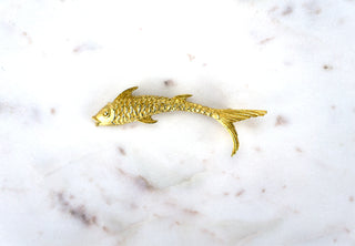Gilded Koi Brooch Pin. Designer: Monet Period: 1970s Dimensions: 3.25” Material: 18k gold plated Condition: Excellent  A symbol of good luck and perseverance in most Asian cultures, this Koi makes a leap forward. Exquisitely detailed scales and fins. Available at Fonfrege.com